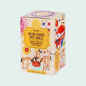 Confezione di infuso biologico "Mellow Rooibos with Vanilla" Ministry of Tea da 20 filtri, decorata con illustrazioni colorate di giraffe. Tisana naturalmente priva di caffeina con note di vaniglia.