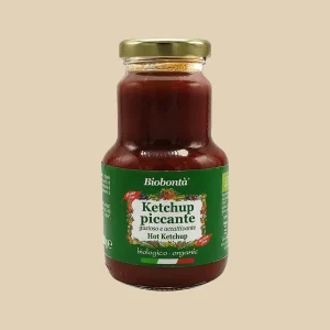 Barattolo in vetro da 250g di ketchup piccante biologico Biobontà con etichetta verde, tappo dorato e diciture "gustoso e accattivante", "gluten free" e "lactose free".