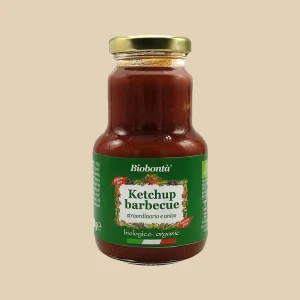 Barattolo in vetro da 250g di ketchup barbecue biologico Biobontà con etichetta verde, tappo dorato e scritte "straordinario e unico", "gluten free", "lactose free".