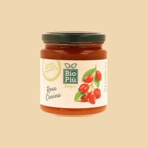 Vasetto di confettura biologica alla rosa canina Bio Più, con etichetta illustrata e tappo verde scuro.