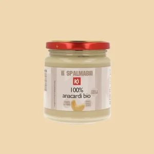 Vasetto di Crema di Anacardi Bio 100% Ki da 275g, fronte dell'etichetta con diciture “Le Spalmabili” e “Fonte di Fibre e Proteine”